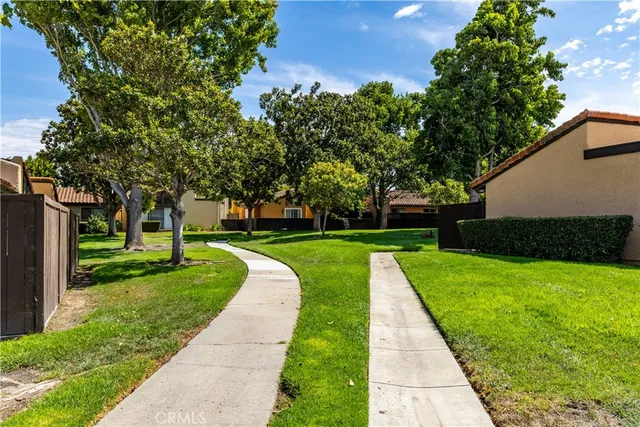 an aerial view of residential house with outdoor space and swimming pool