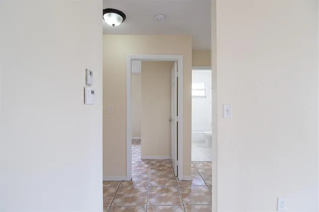a view of a bathroom with a glass door