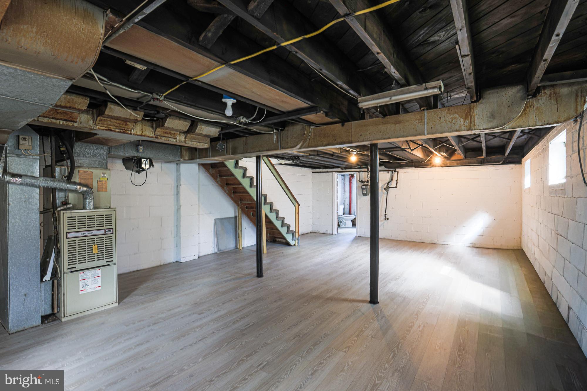 3914 Bancroft Road Baltimore, MD 21215 - Photo 21 of 25 a view of an empty room with wooden floor