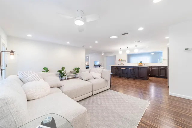 a kitchen with stainless steel appliances and kitchen island