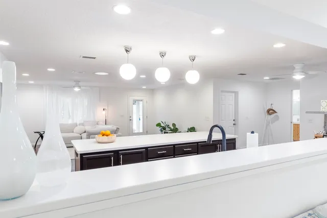 a bathroom with a tub shower and mirror