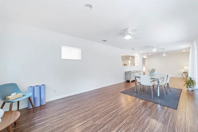 a bathroom with a toilet a sink and shower