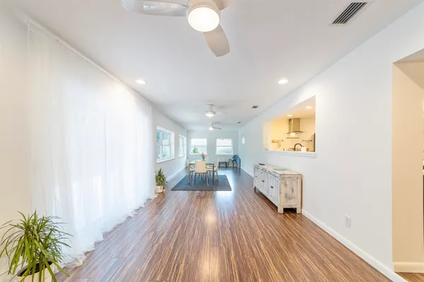 a bedroom with furniture and a wooden floor