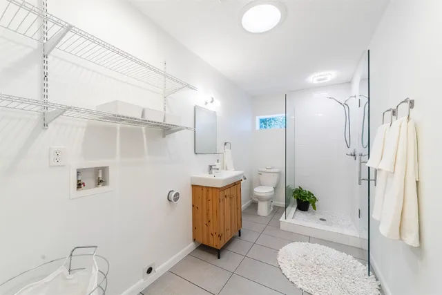 a view of patio with table and chairs under an umbrella