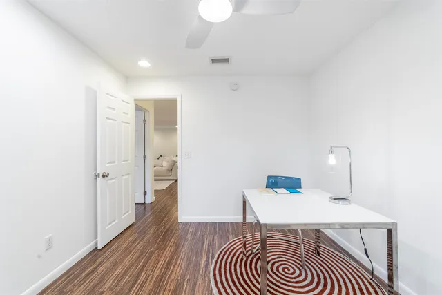 a view of a field with an ocean