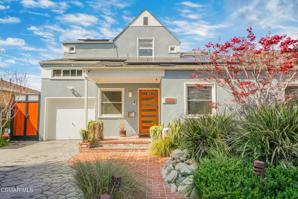 a front view of house with an outdoor space