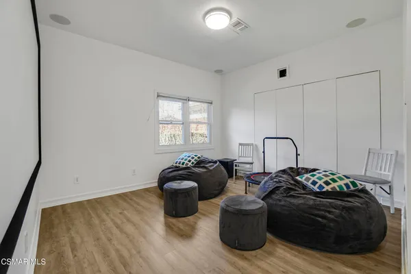 a bed room with a bed and a window