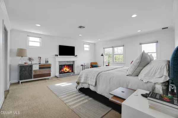 a bed room with a bed and a fireplace