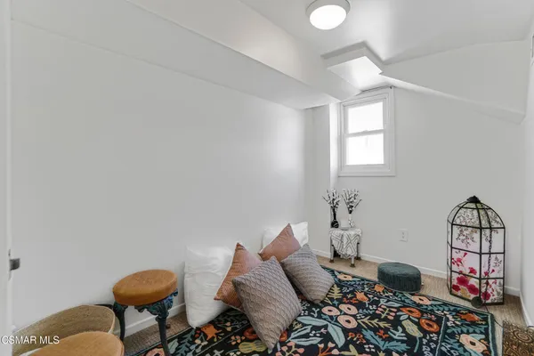 a bedroom with furniture and a window