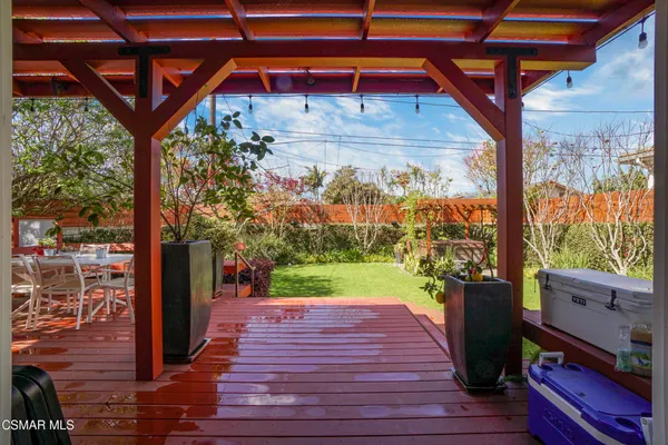 a view of a porch with wooden floor