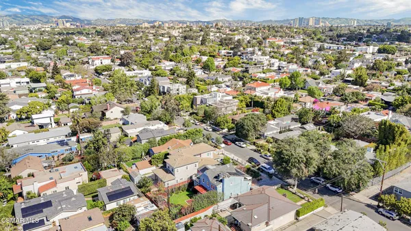 an aerial view of residential houses with outdoor space