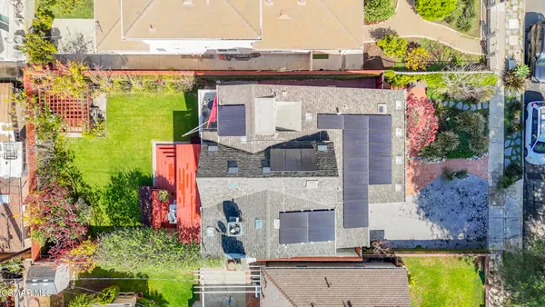 an aerial view of a house with a swimming pool