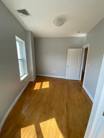 a view of an empty room and window