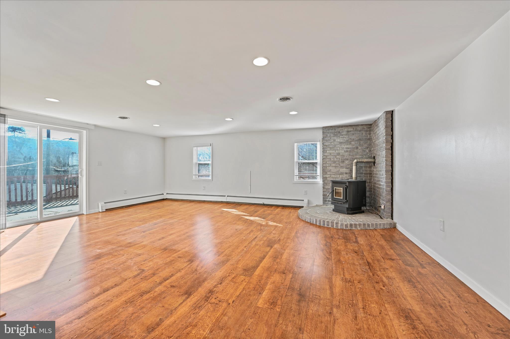 225 Owl Creek Road Tamaqua, PA 18252 - Photo 14 of 46 a view of an empty room with wooden floor and a window