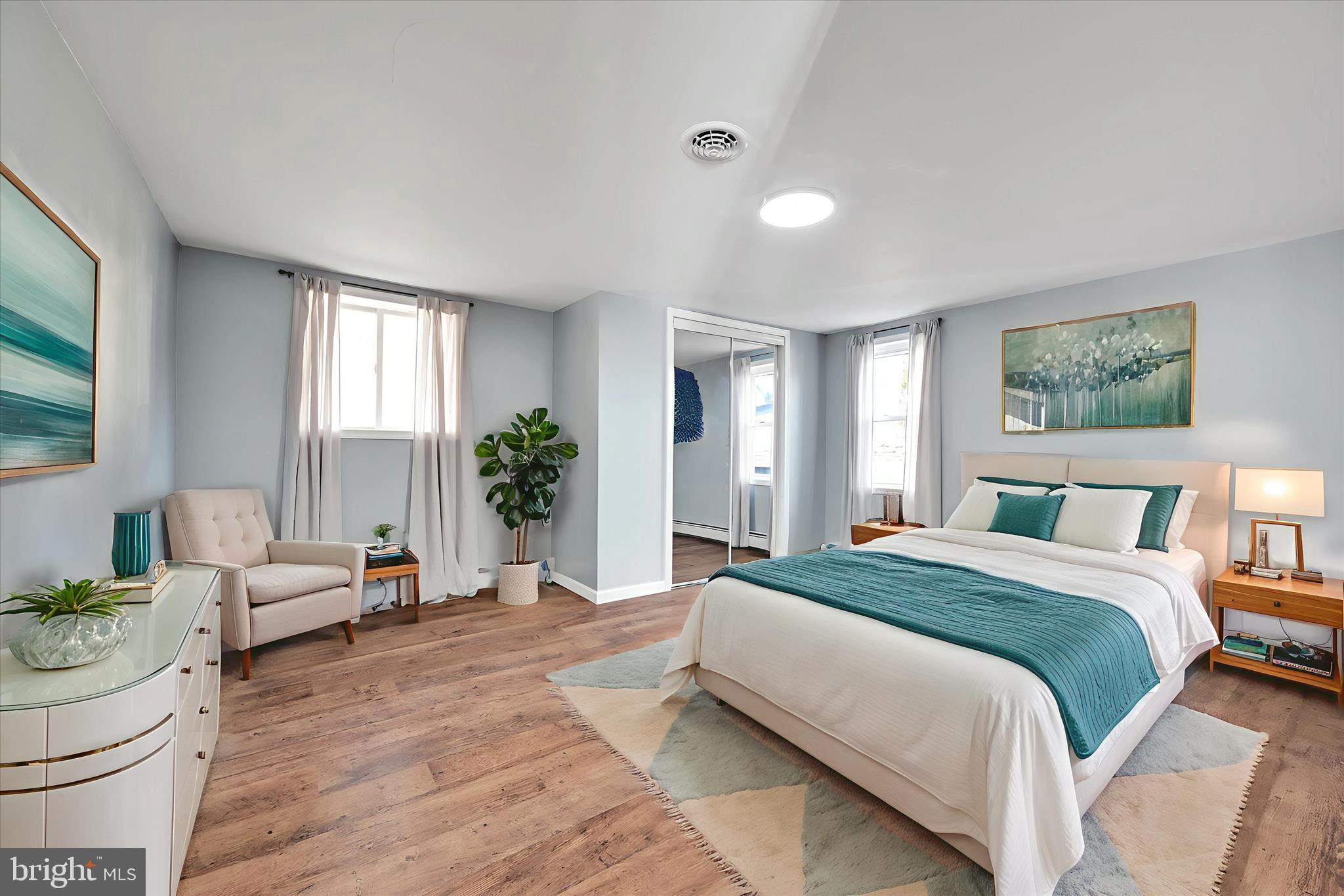 225 Owl Creek Road Tamaqua, PA 18252 - Photo 26 of 46 a spacious bedroom with a bed and a couch