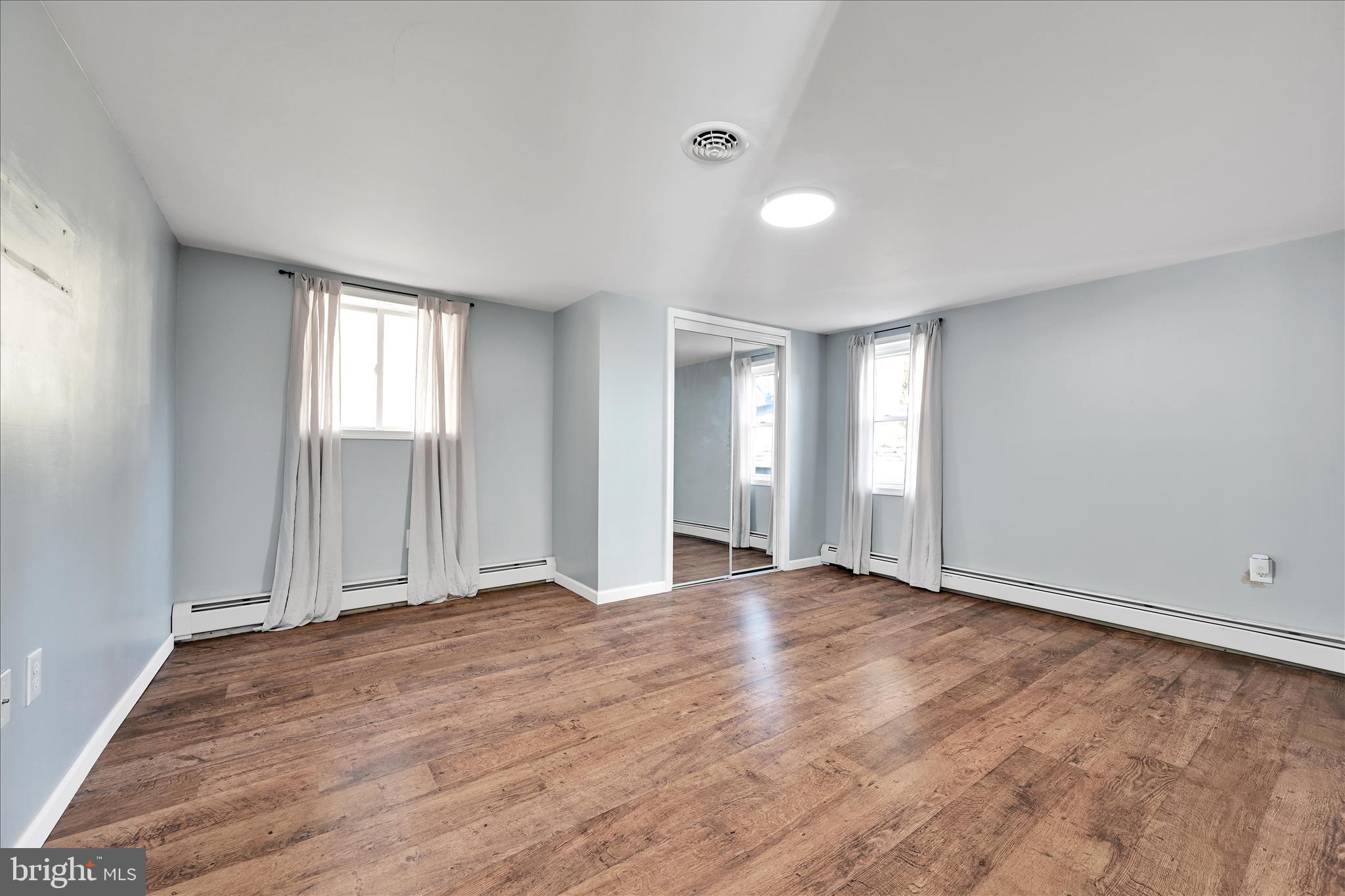 225 Owl Creek Road Tamaqua, PA 18252 - Photo 27 of 46 wooden floor in an empty room with a window