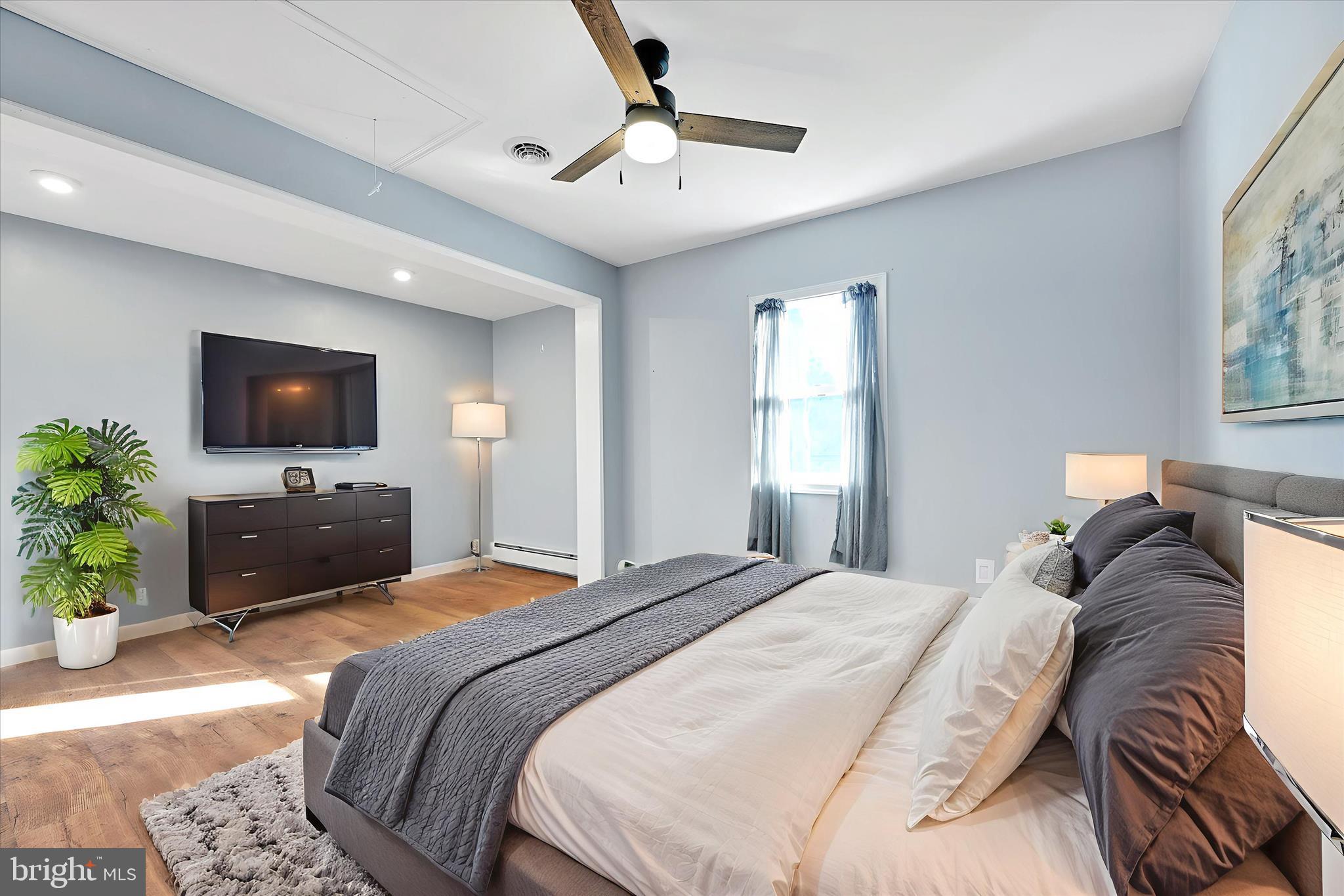 225 Owl Creek Road Tamaqua, PA 18252 - Photo 30 of 46 a bedroom with a bed and a flat screen tv