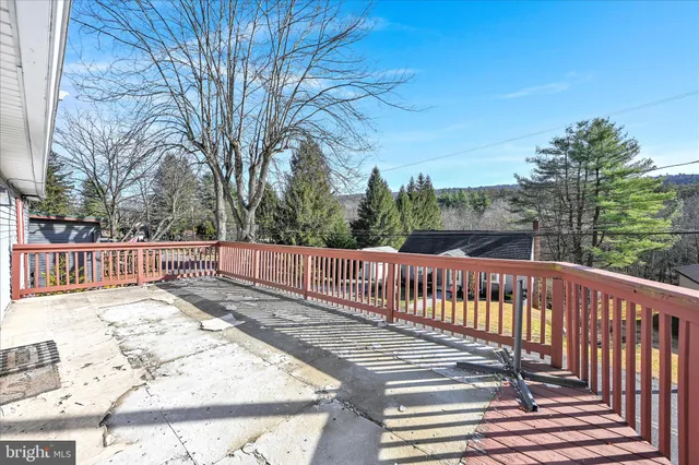 a view of a wooden roof deck