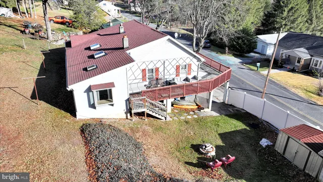 an aerial view of a house with outdoor space