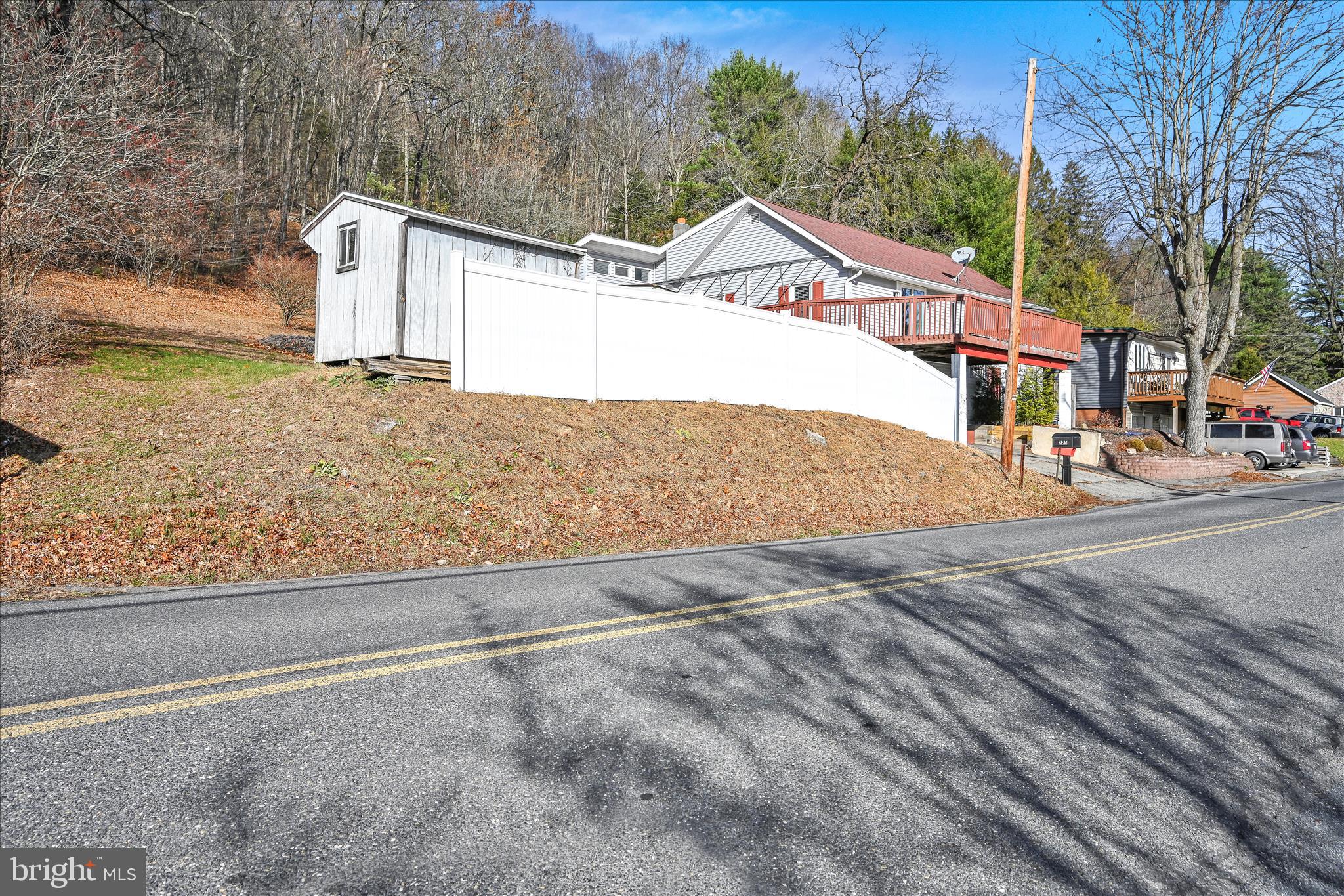 225 Owl Creek Road Tamaqua, PA 18252 - Photo 7 of 46 a view of a house with a snow on the road