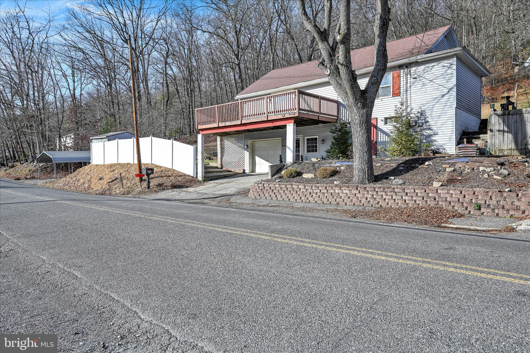 225 Owl Creek Road Tamaqua, PA 18252 - Photo 10 of 46 a front view of a house with a yard and garage