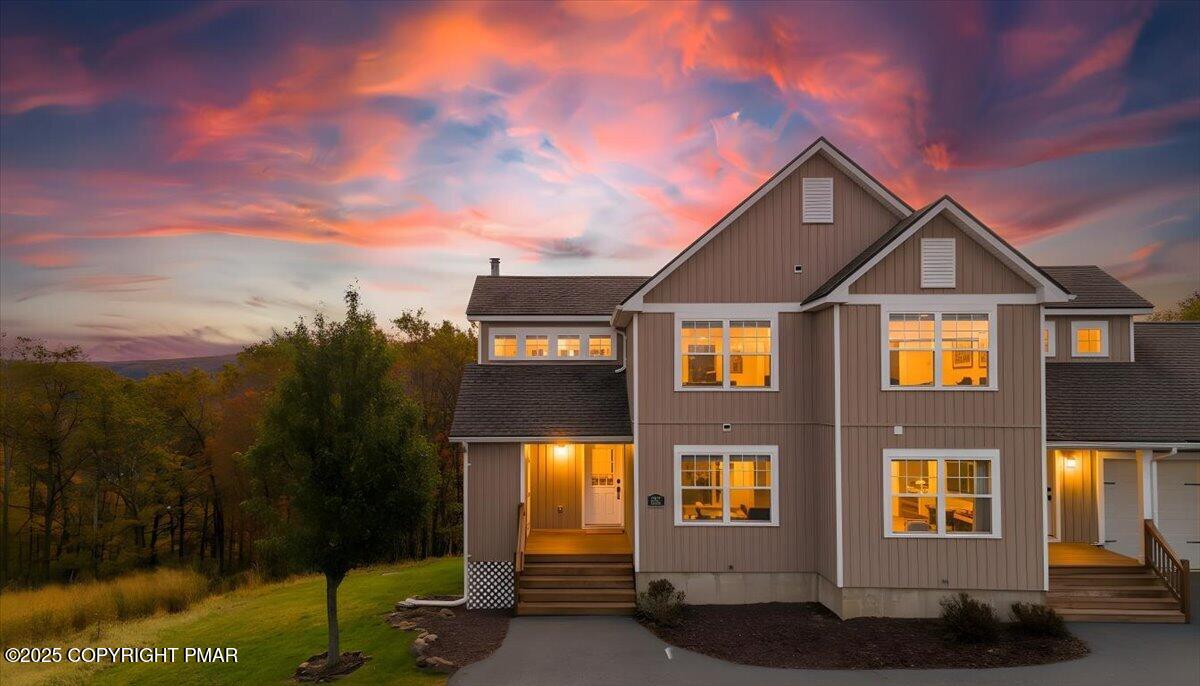 a front view of a house with a yard