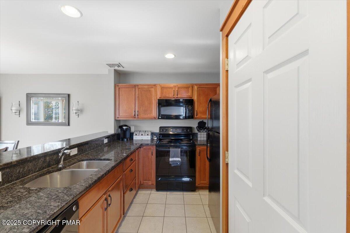 557 Upper Deer Valley Road Tannersville, PA 18372 - Photo 13 of 47 a kitchen with granite countertop a sink and counter top space