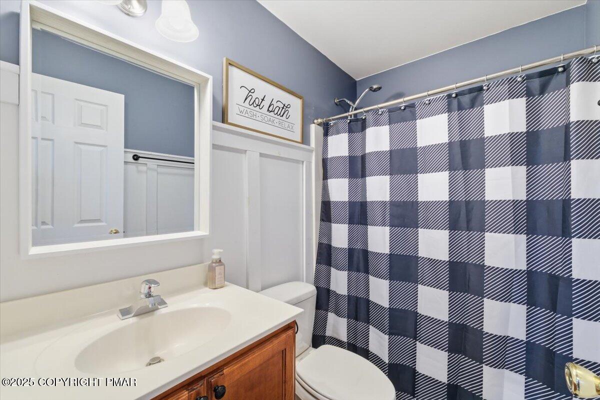 557 Upper Deer Valley Road Tannersville, PA 18372 - Photo 21 of 47 a bathroom with a sink a toilet a shower and a mirror
