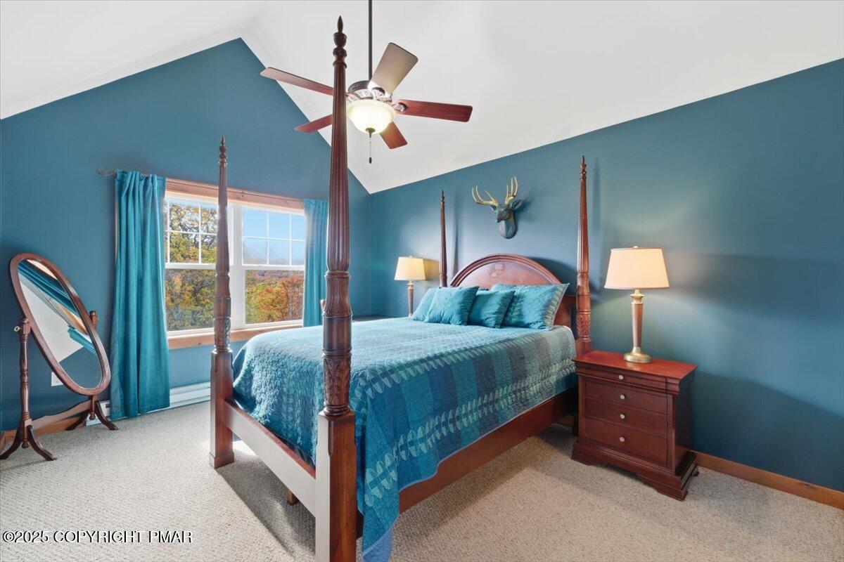 557 Upper Deer Valley Road Tannersville, PA 18372 - Photo 24 of 47 a bedroom with a bed and a chandelier