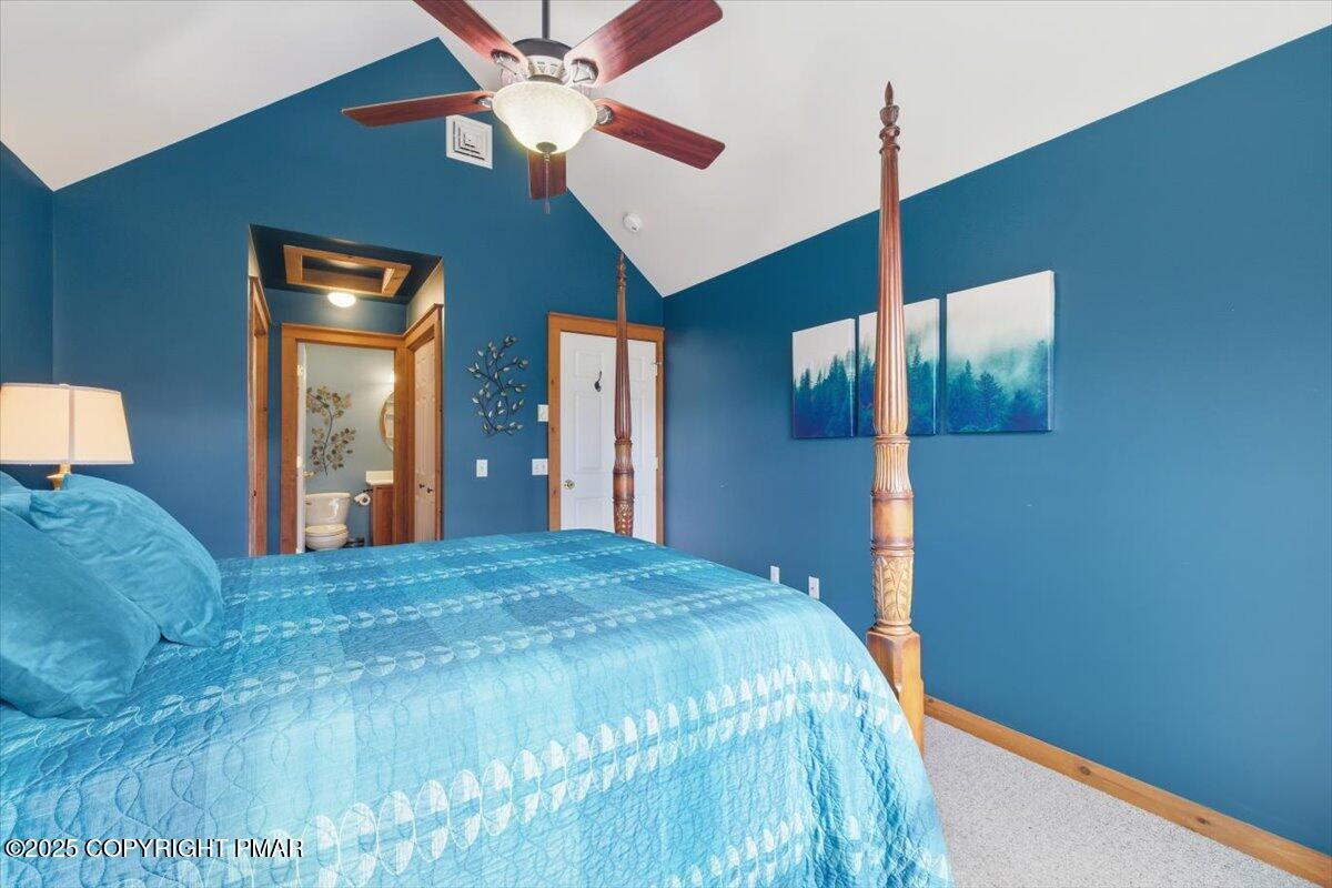 557 Upper Deer Valley Road Tannersville, PA 18372 - Photo 25 of 47 a bedroom with a large bed and a chandelier