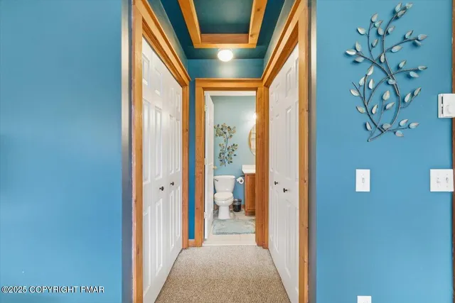 a bathroom with a sink toilet and mirror