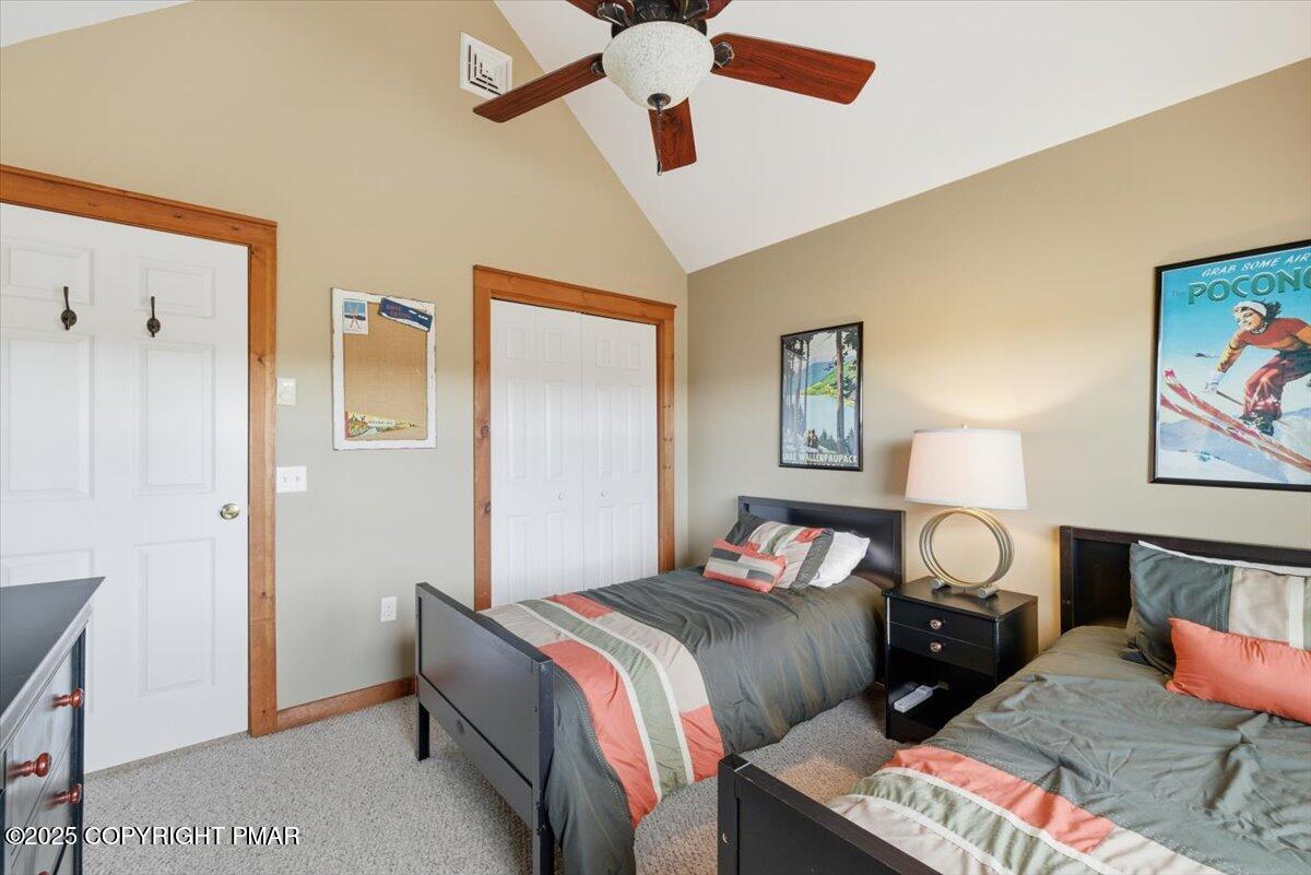 557 Upper Deer Valley Road Tannersville, PA 18372 - Photo 29 of 47 a bedroom with bed and a chandelier