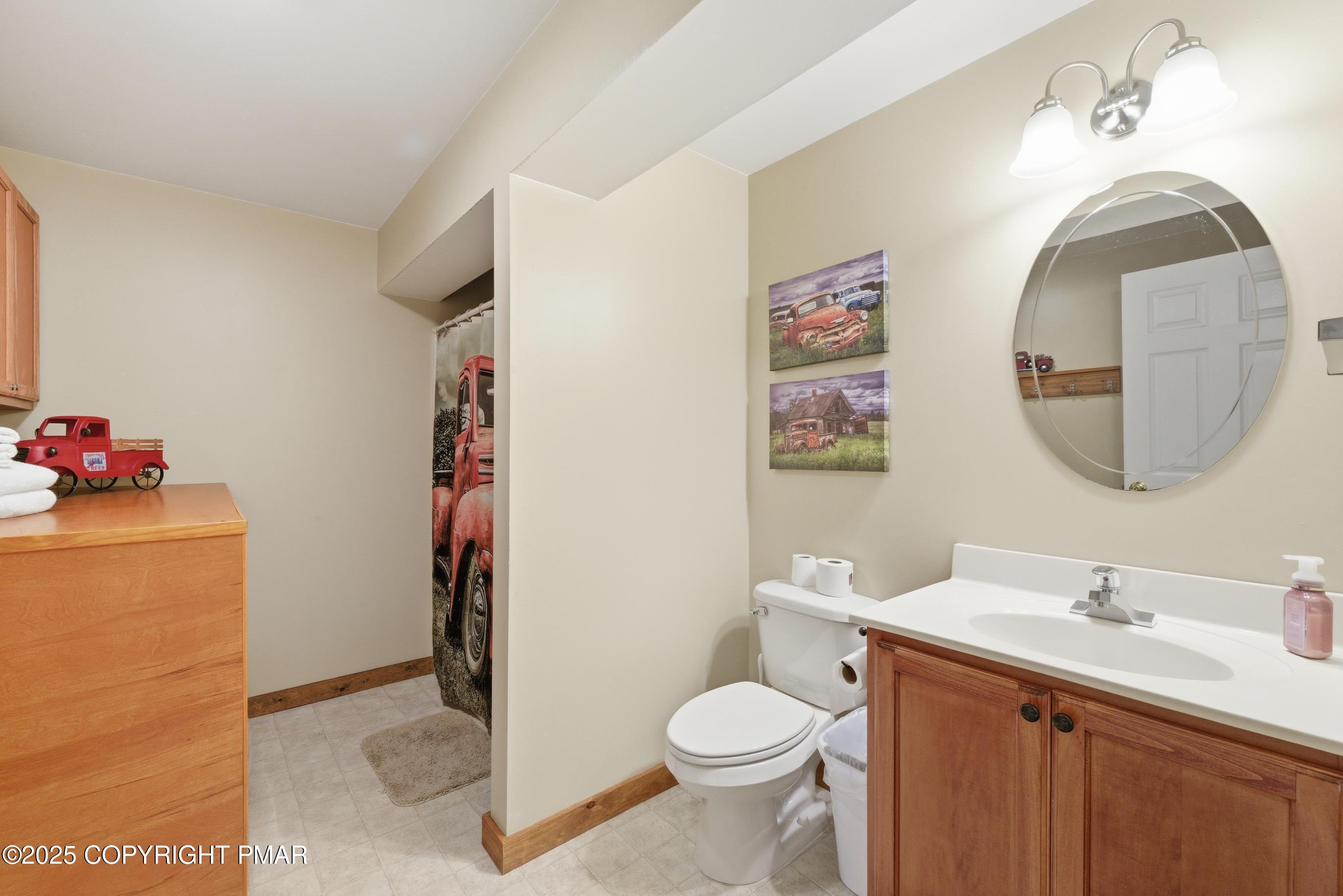 557 Upper Deer Valley Road Tannersville, PA 18372 - Photo 36 of 47 a bathroom with a sink and a mirror