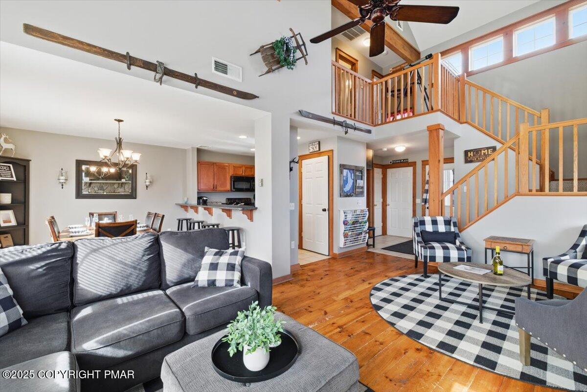557 Upper Deer Valley Road Tannersville, PA 18372 - Photo 8 of 47 a living room with furniture and wooden floor