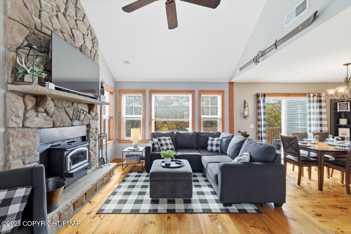 557 Upper Deer Valley Road Tannersville, PA 18372 - Photo 9 of 47 a living room with furniture fireplace and a large window
