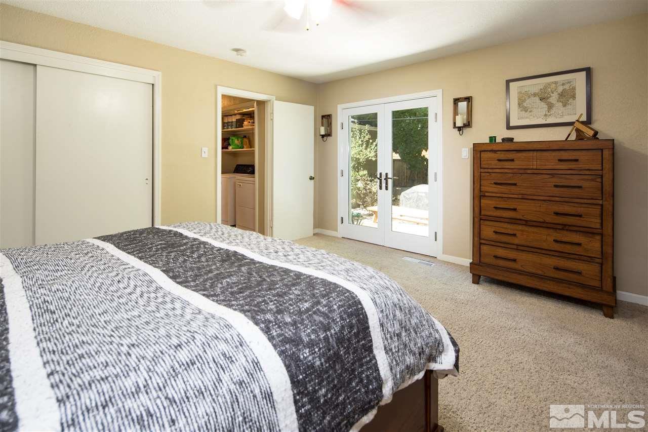 70 Bisby Street Reno, NV 89512 - Photo 11 of 25 a bedroom with a bed and a dresser