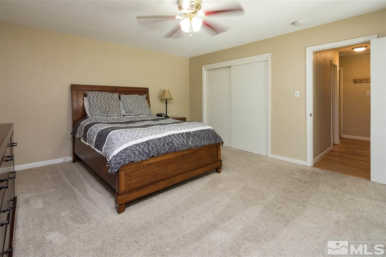 70 Bisby Street Reno, NV 89512 - Photo 12 of 25 a bedroom with a bed and window
