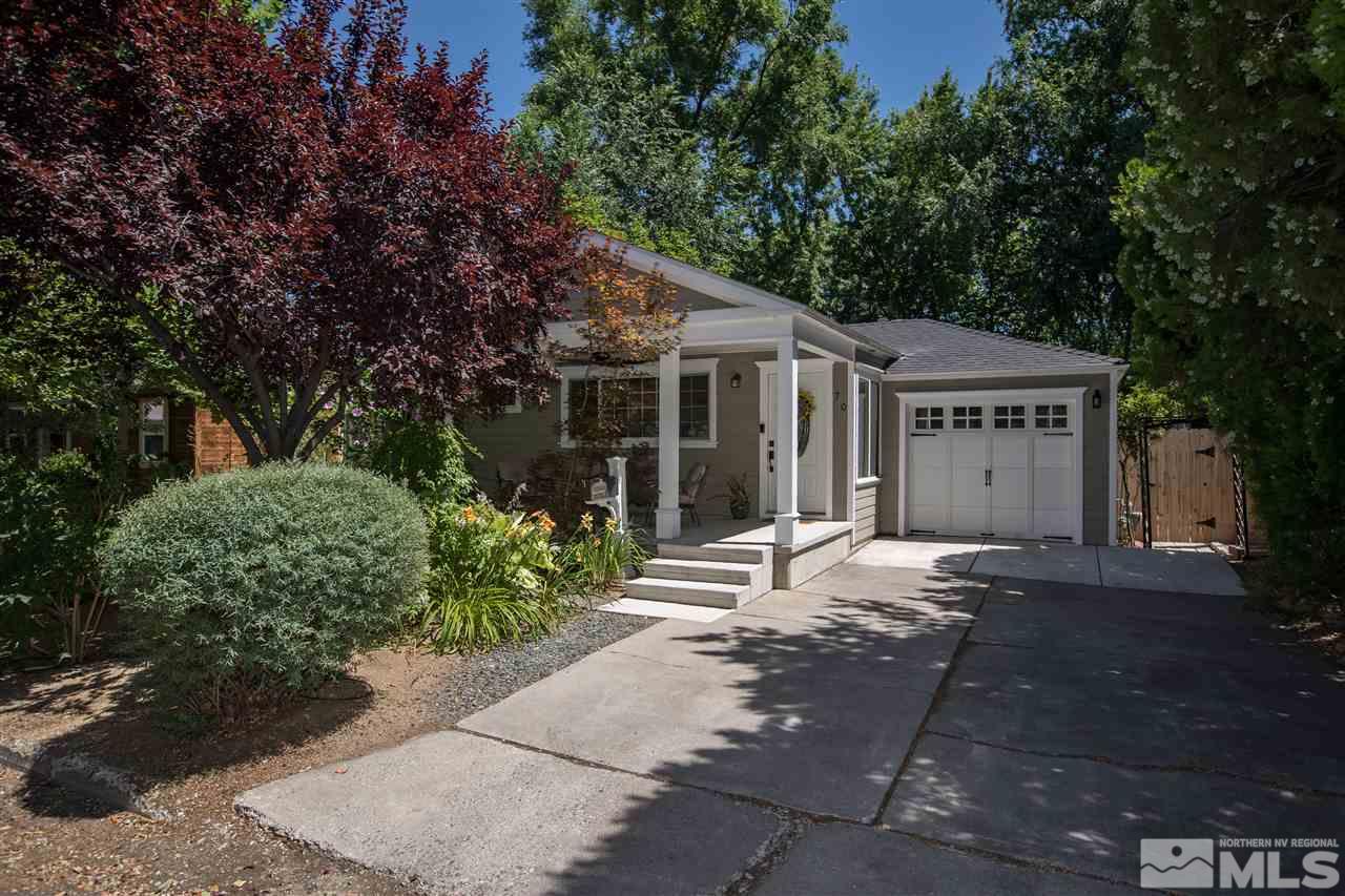 70 Bisby Street Reno, NV 89512 - Photo 2 of 25 a front view of a house with a garden and plants