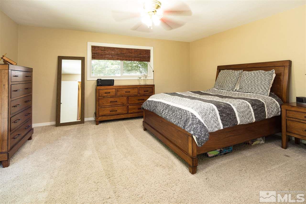 70 Bisby Street Reno, NV 89512 - Photo 10 of 25 a bed sitting in a bedroom next to a window