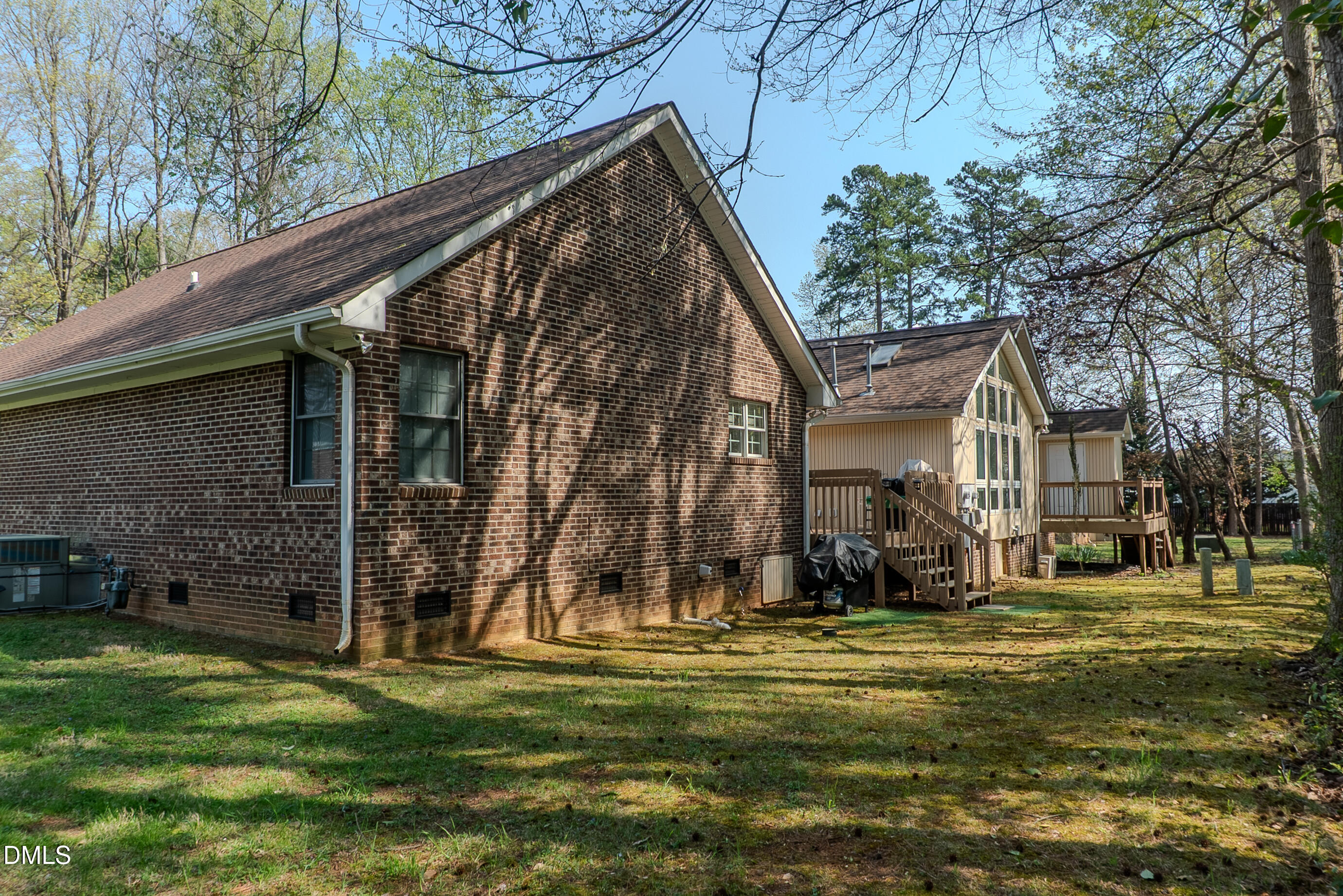 2012 South Mebane Street, Unit 102 Burlington, NC 27215 - Photo 11 of 35 a backyard of a house with lots of green space