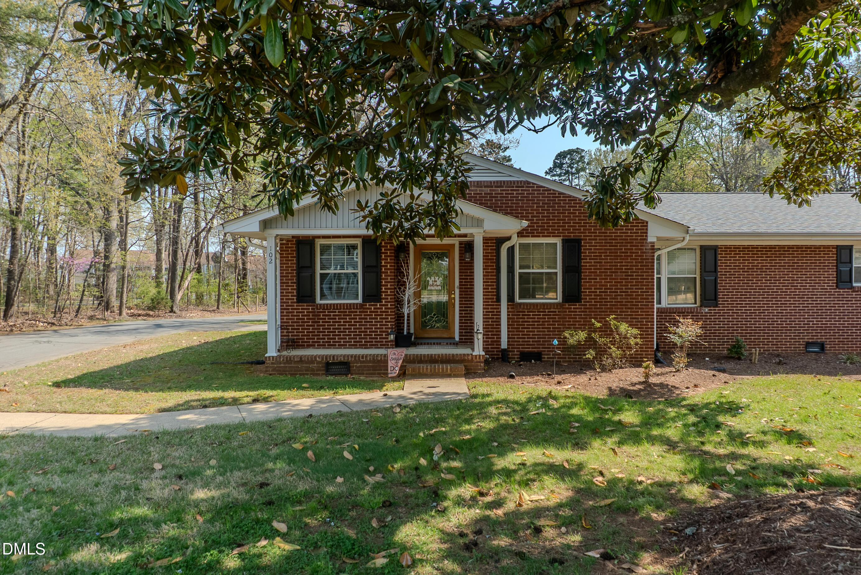 2012 South Mebane Street, Unit 102 Burlington, NC 27215 - Photo 19 of 35 a backyard of a house with table and chairs