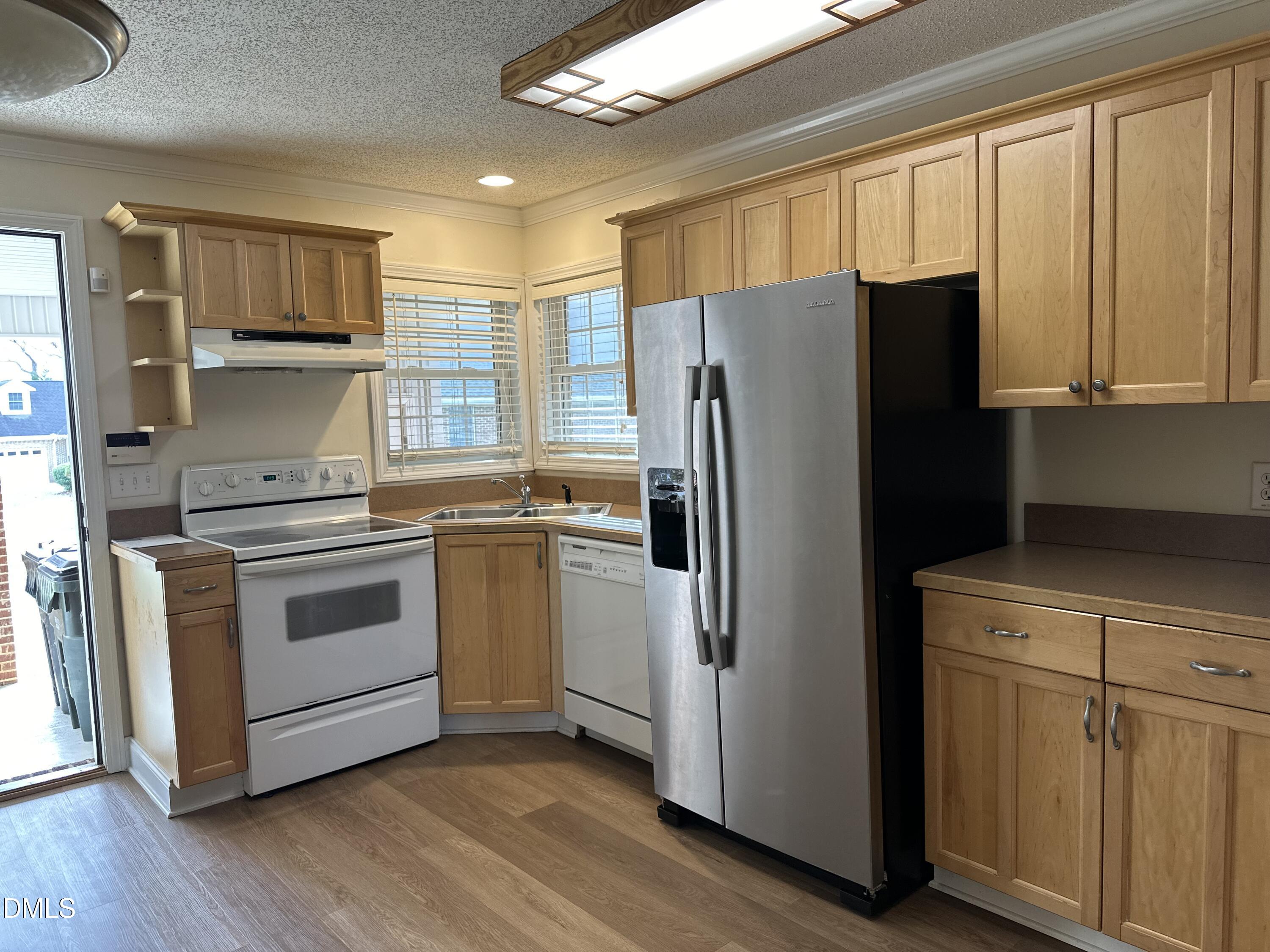 2012 South Mebane Street, Unit 102 Burlington, NC 27215 - Photo 27 of 35 a kitchen with a refrigerator stove and sink