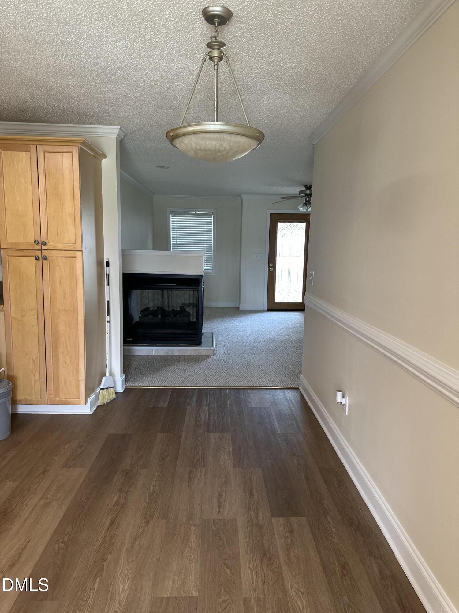 2012 South Mebane Street, Unit 102 Burlington, NC 27215 - Photo 28 of 35 a view of a livingroom with wooden floor fireplace and window