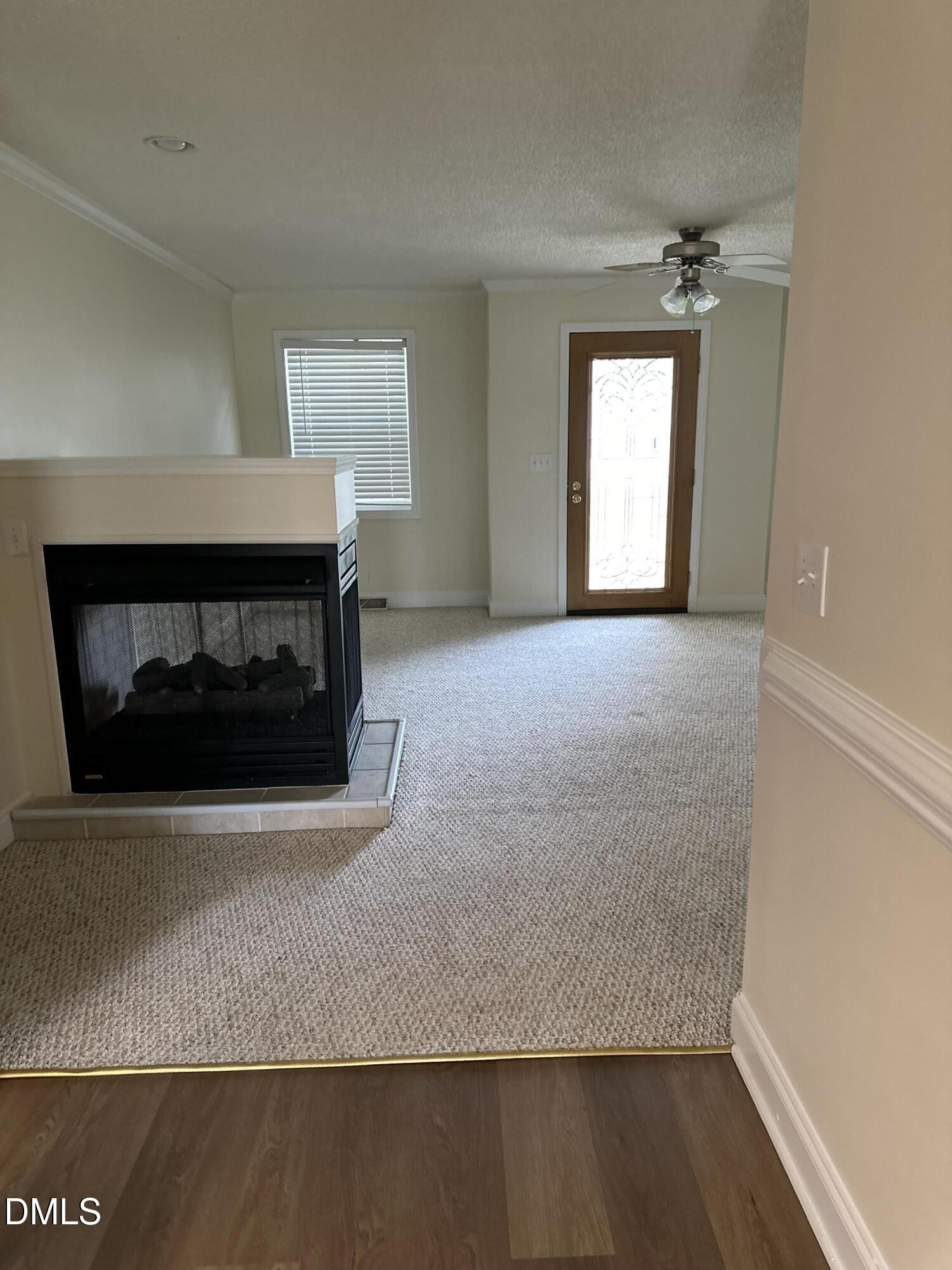 2012 South Mebane Street, Unit 102 Burlington, NC 27215 - Photo 32 of 35 a living room with a fireplace
