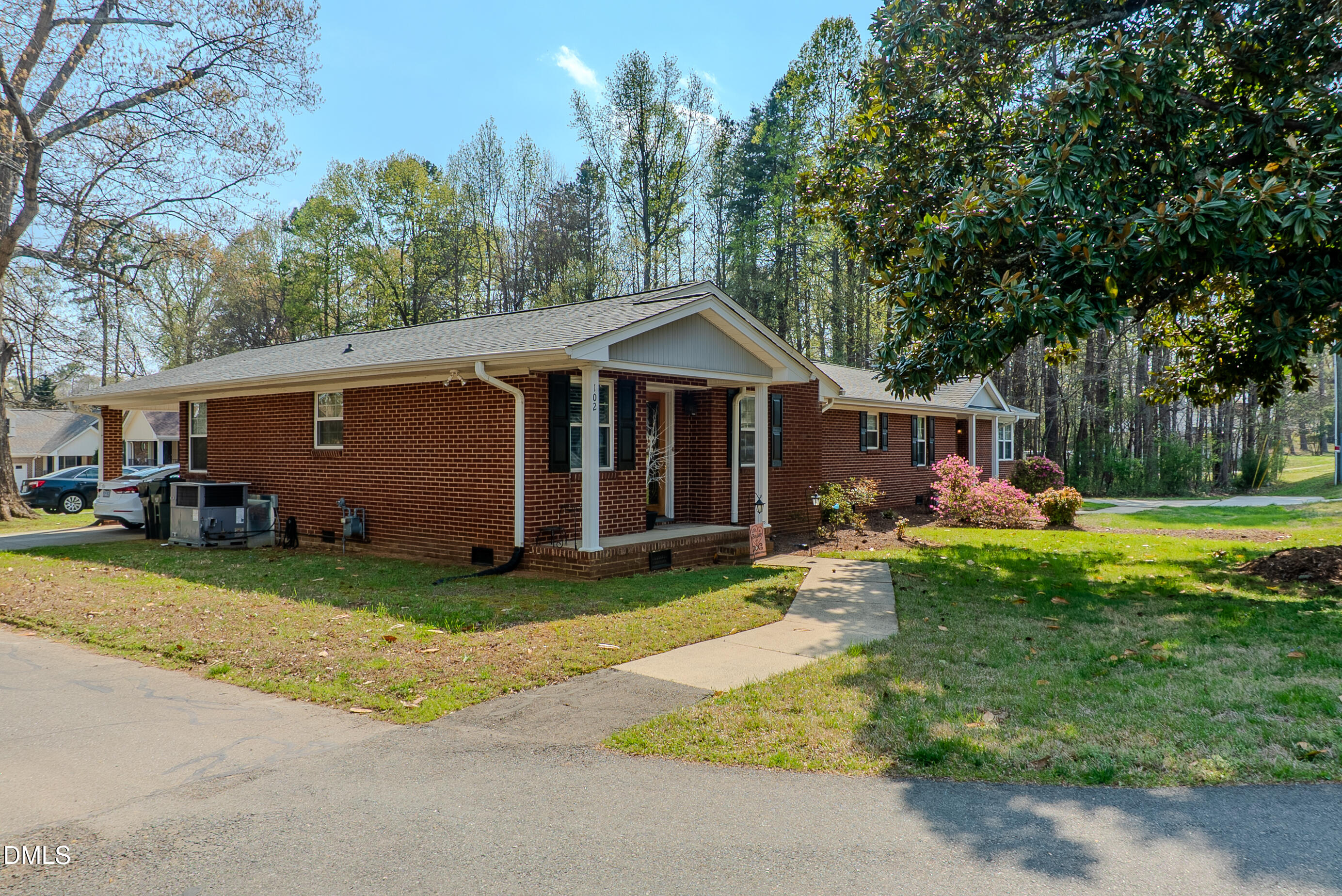 2012 South Mebane Street, Unit 102 Burlington, NC 27215 - Photo 3 of 35 a front view of a house with garden