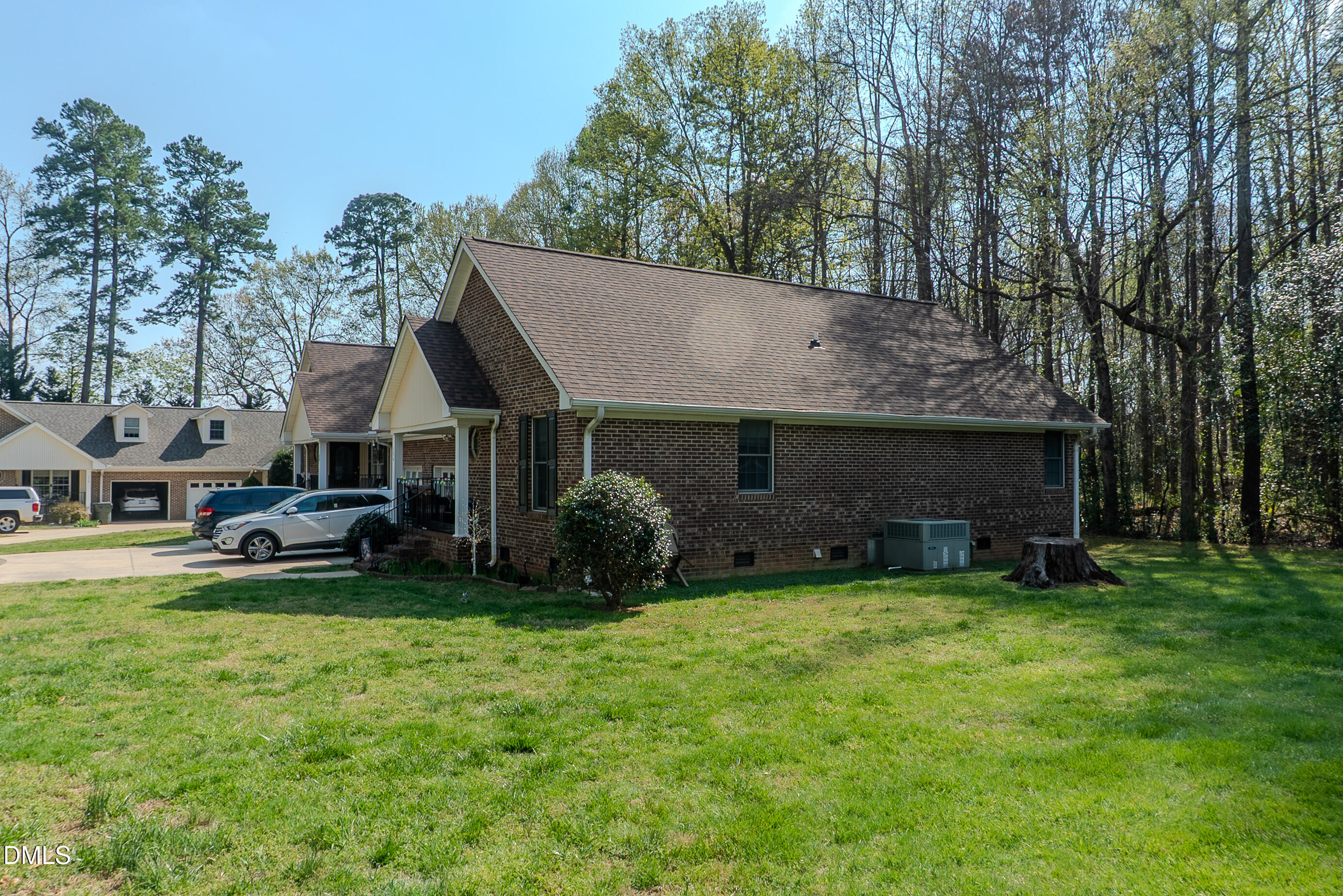 2012 South Mebane Street, Unit 102 Burlington, NC 27215 - Photo 4 of 35 a view of a house with a yard and sitting area