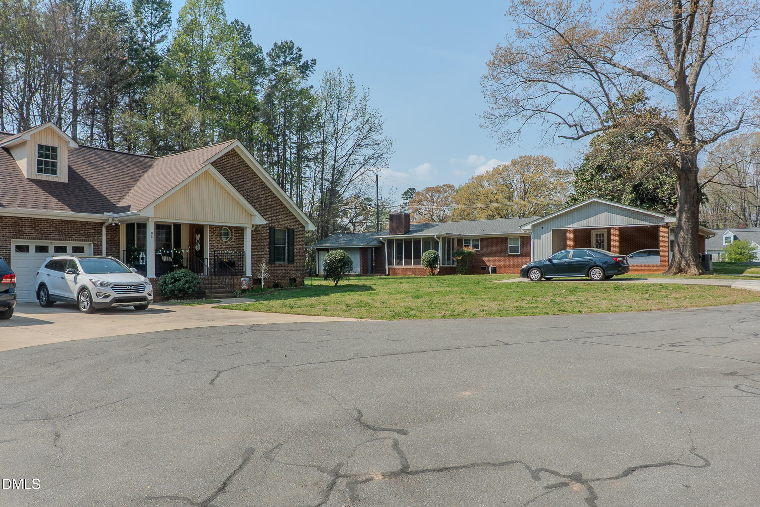 2012 South Mebane Street, Unit 102 Burlington, NC 27215 - Photo 7 of 35 a front view of a house with a yard and garage
