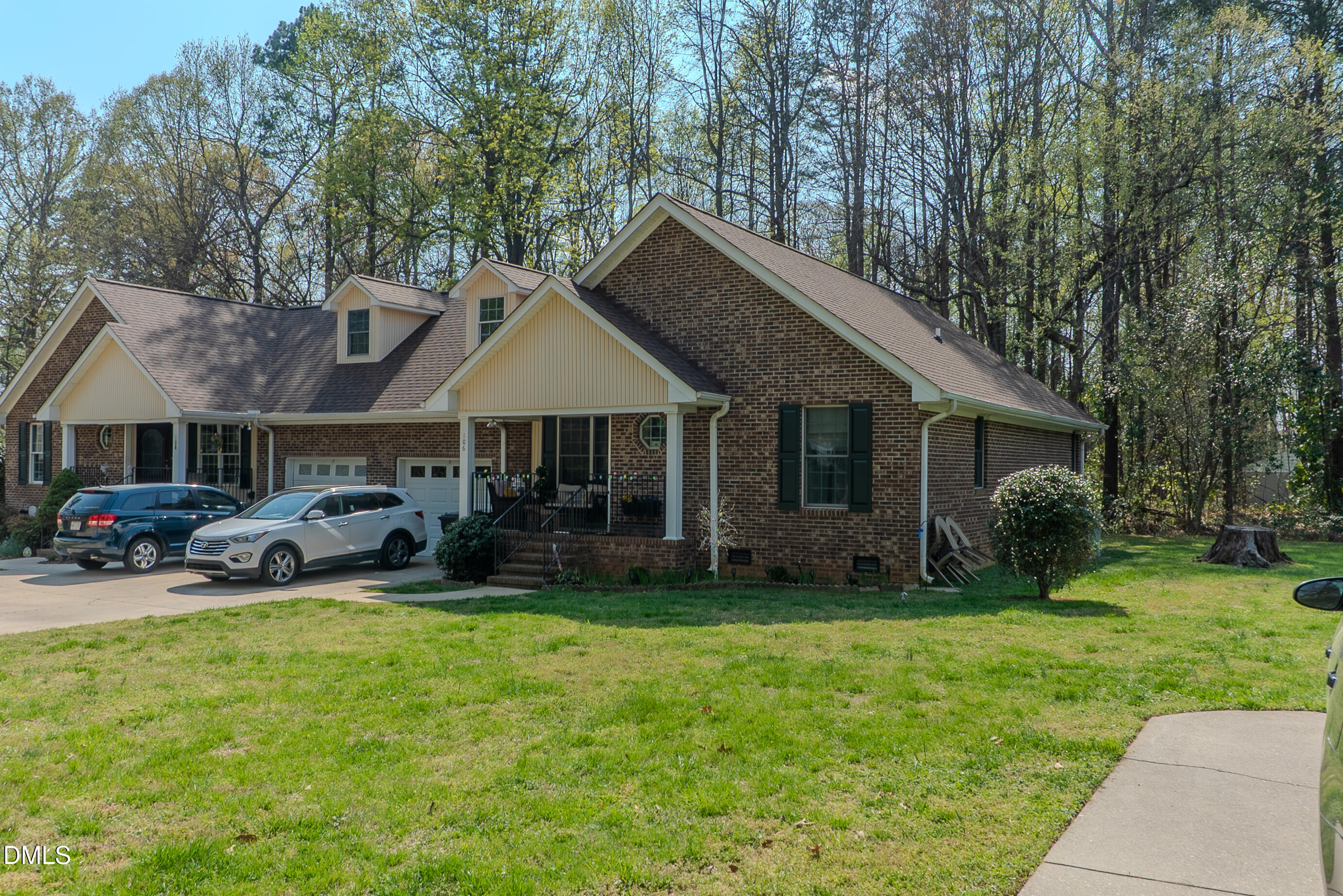 2012 South Mebane Street, Unit 102 Burlington, NC 27215 - Photo 9 of 35 a view of house with outdoor seating and green space