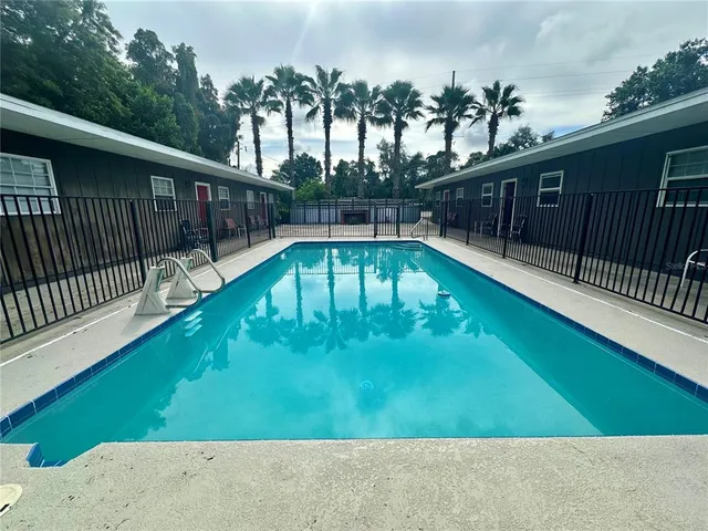 a view of a swimming pool with a patio