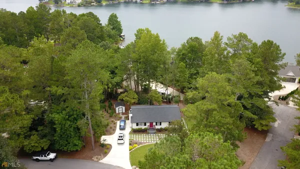 an aerial view of a house with a lake view
